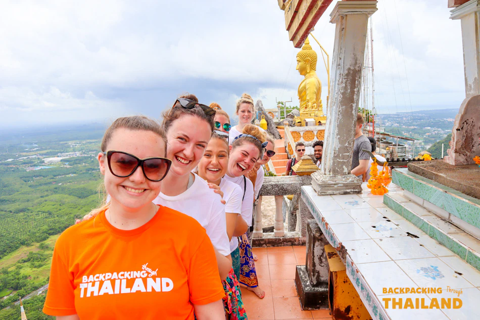 Travellers at the top of the Tiger Cave Temple steps above Krabi