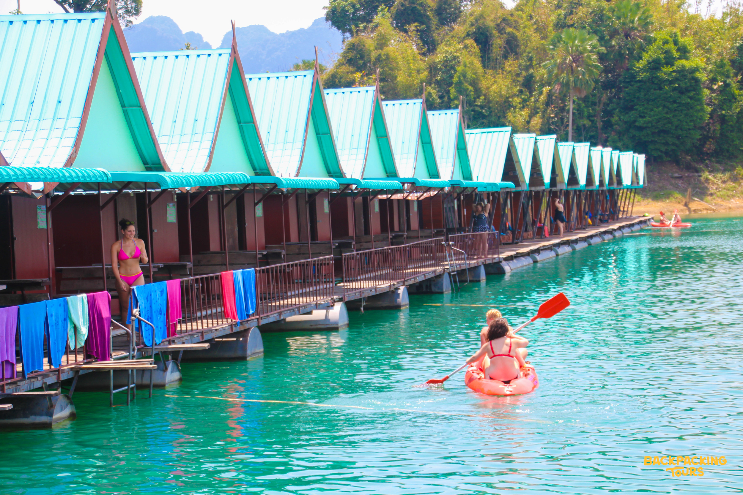 Tourists enjoy kayaking and relaxing at the floating bungalows on Cheow Lan Lake, Khao Sok National Park.