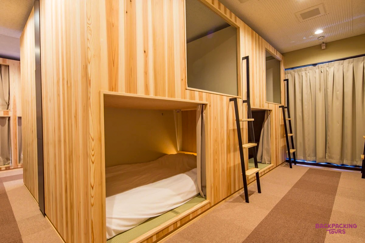 Modern wooden sleeping pods offer a cozy and private stay at a hostel in Kyoto.