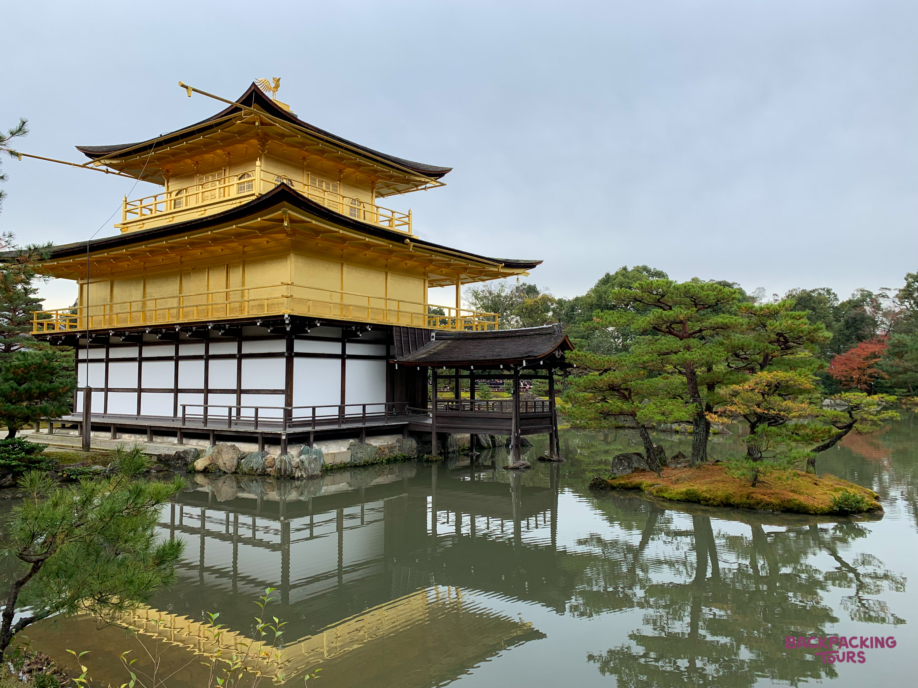 The stunning Golden Pavilion, a gold-emblazoned spectacle, reflected in the tranquil lake in Kyoto.
