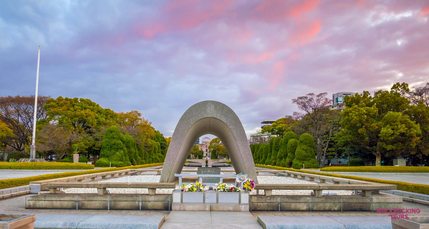 The poignant Cenotaph for the A-bomb Victims in Hiroshima Peace Memorial Park at dusk.
