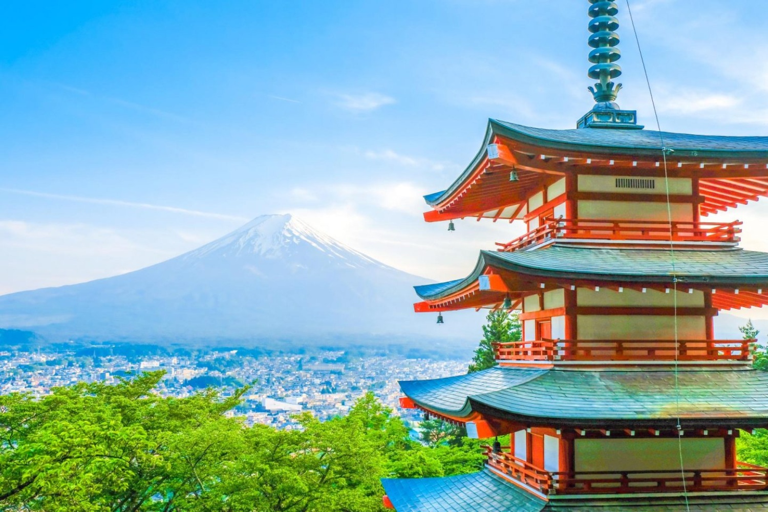 Stunning view of Chureito Pagoda and snow-capped Mount Fuji on a clear day in Japan.