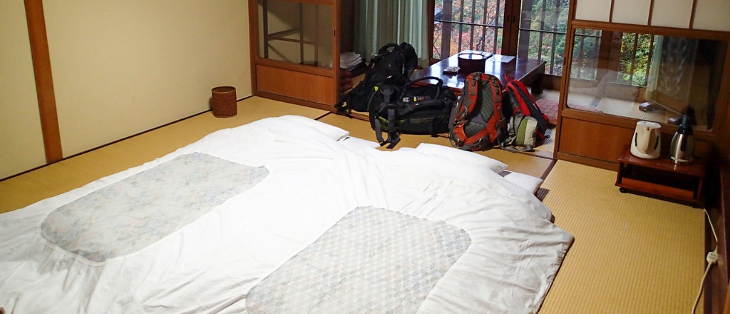 Traditional Japanese room with futons and tatami mats, ready for a restful night in Koyasan.