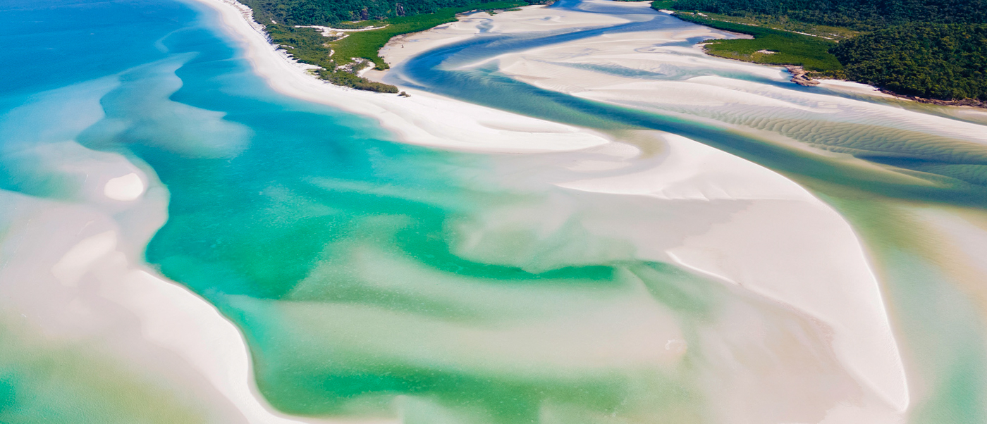 Stunning aerial view of swirling white sands and turquoise waters at Whitehaven Beach, Whitsundays.