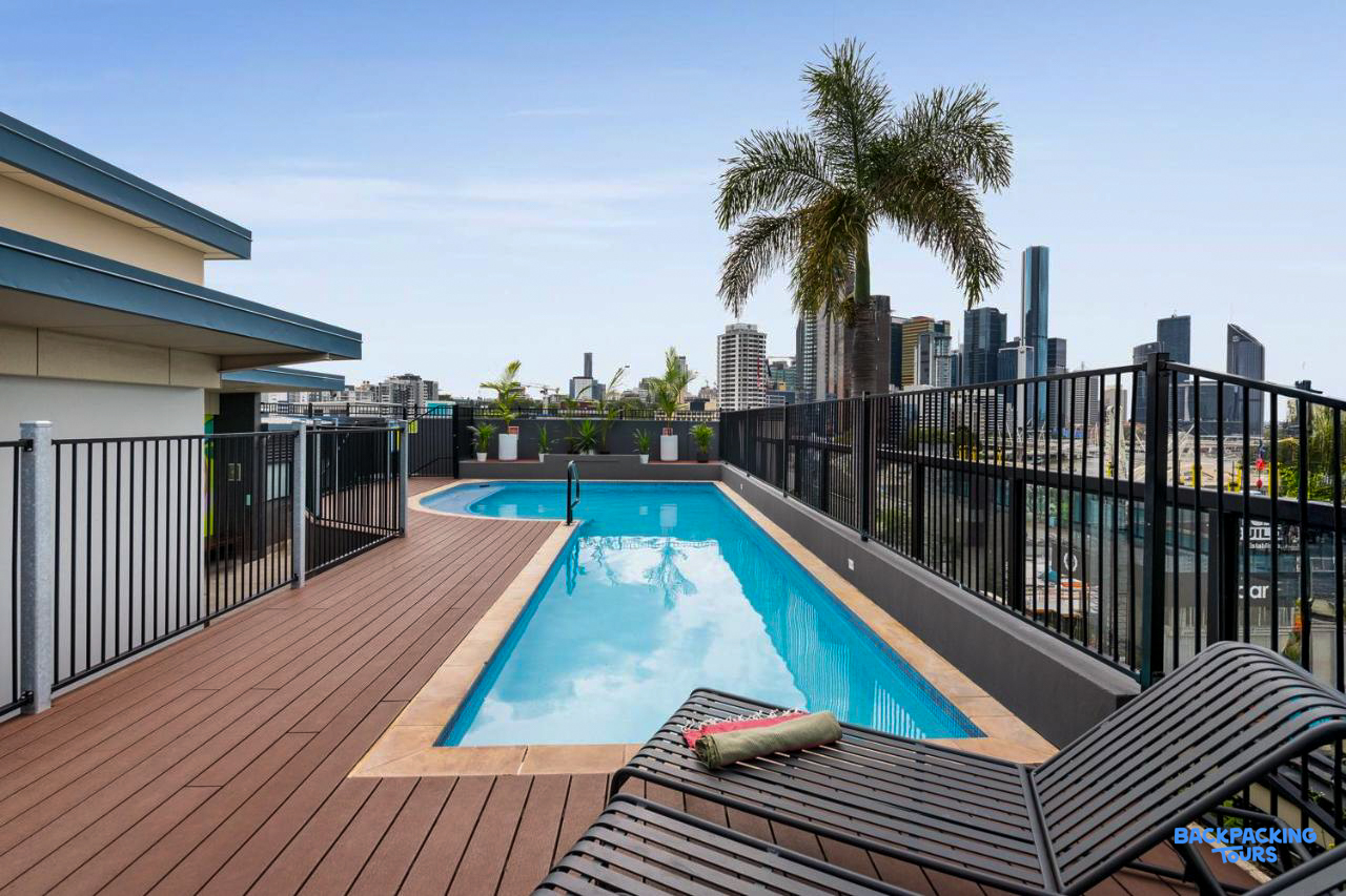 Enjoy the inviting rooftop swimming pool and sun deck with views of the Brisbane city skyline.