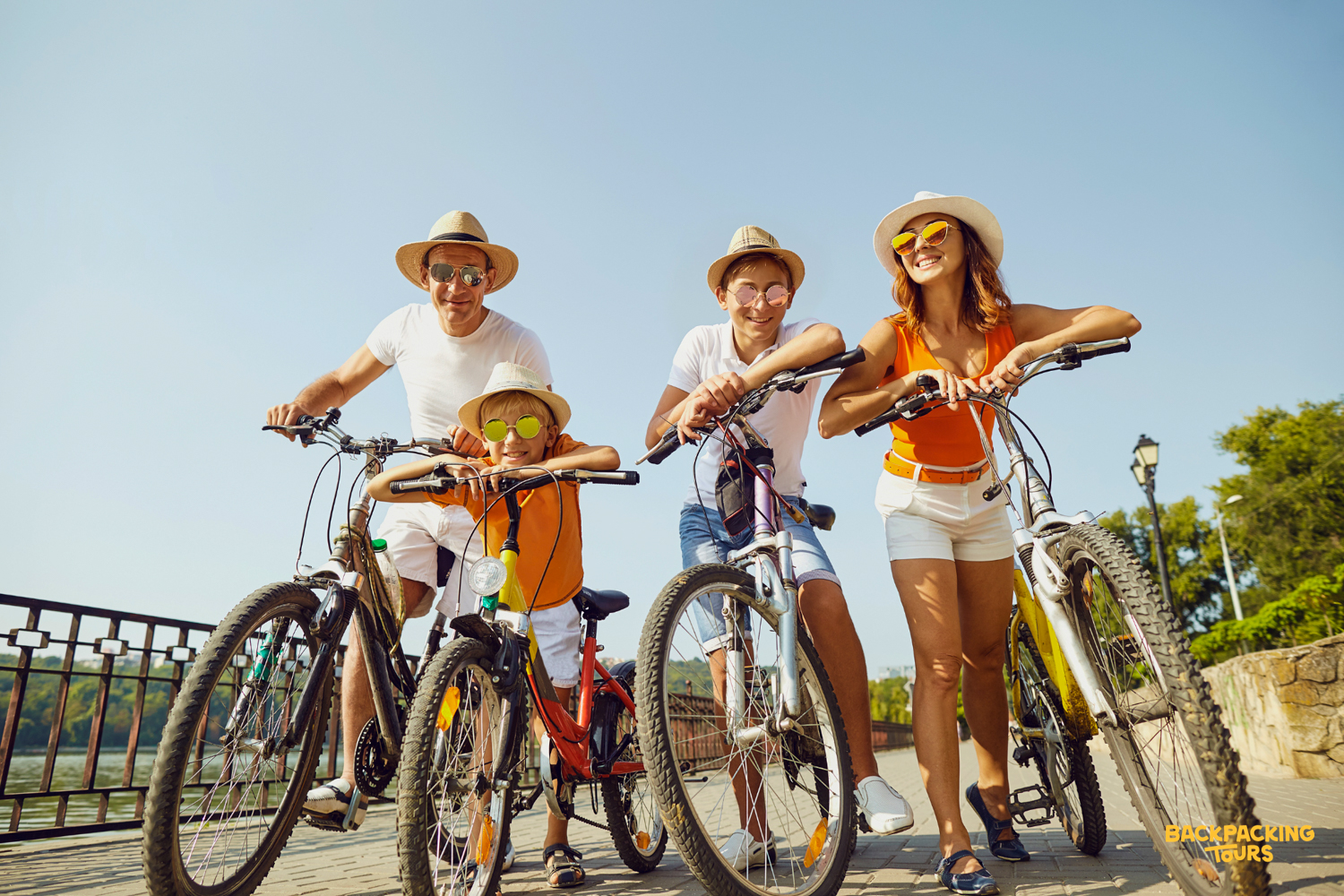 A happy family enjoys a sunny bicycle ride on Gili Trawangan.
