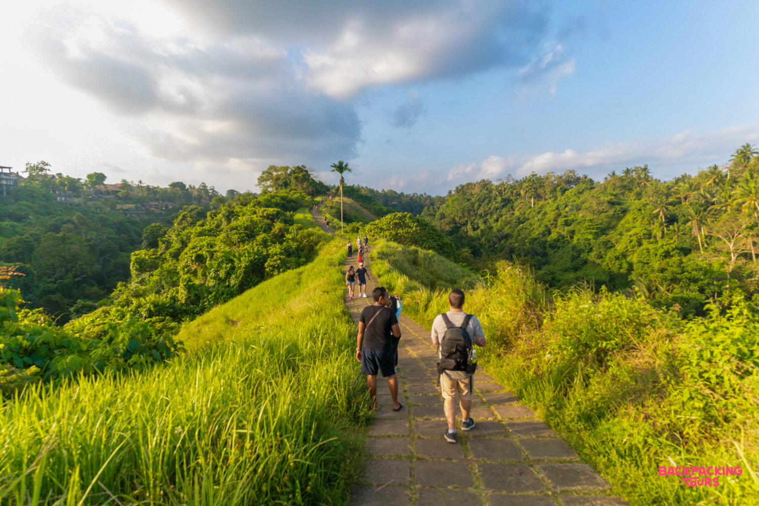 Hikers enjoy the stunning views from the Campuhan Ridge Walk in Bali's beautiful Ubud.