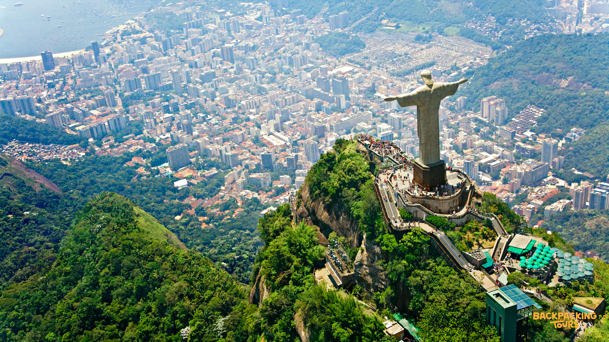 The iconic Christ the Redeemer statue majestically overlooks the vibrant city of Rio de Janeiro, Brazil.