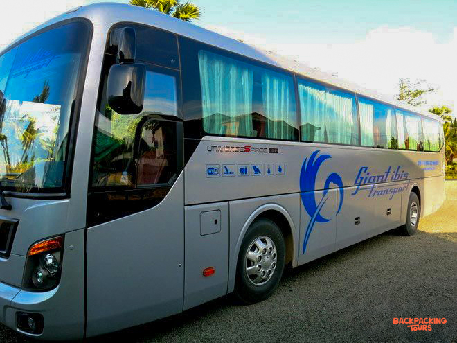 The comfortable Giant Ibis sleeper bus, featuring large windows, for overnight journeys across Cambodia.