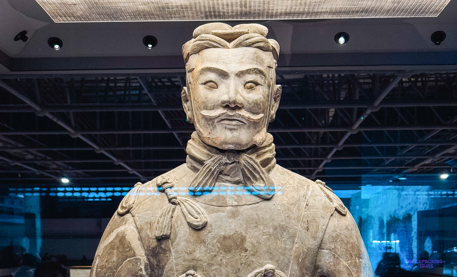 A close-up of a Terracotta Warrior statue, showcasing its intricate facial features and uniform in Xi'an.