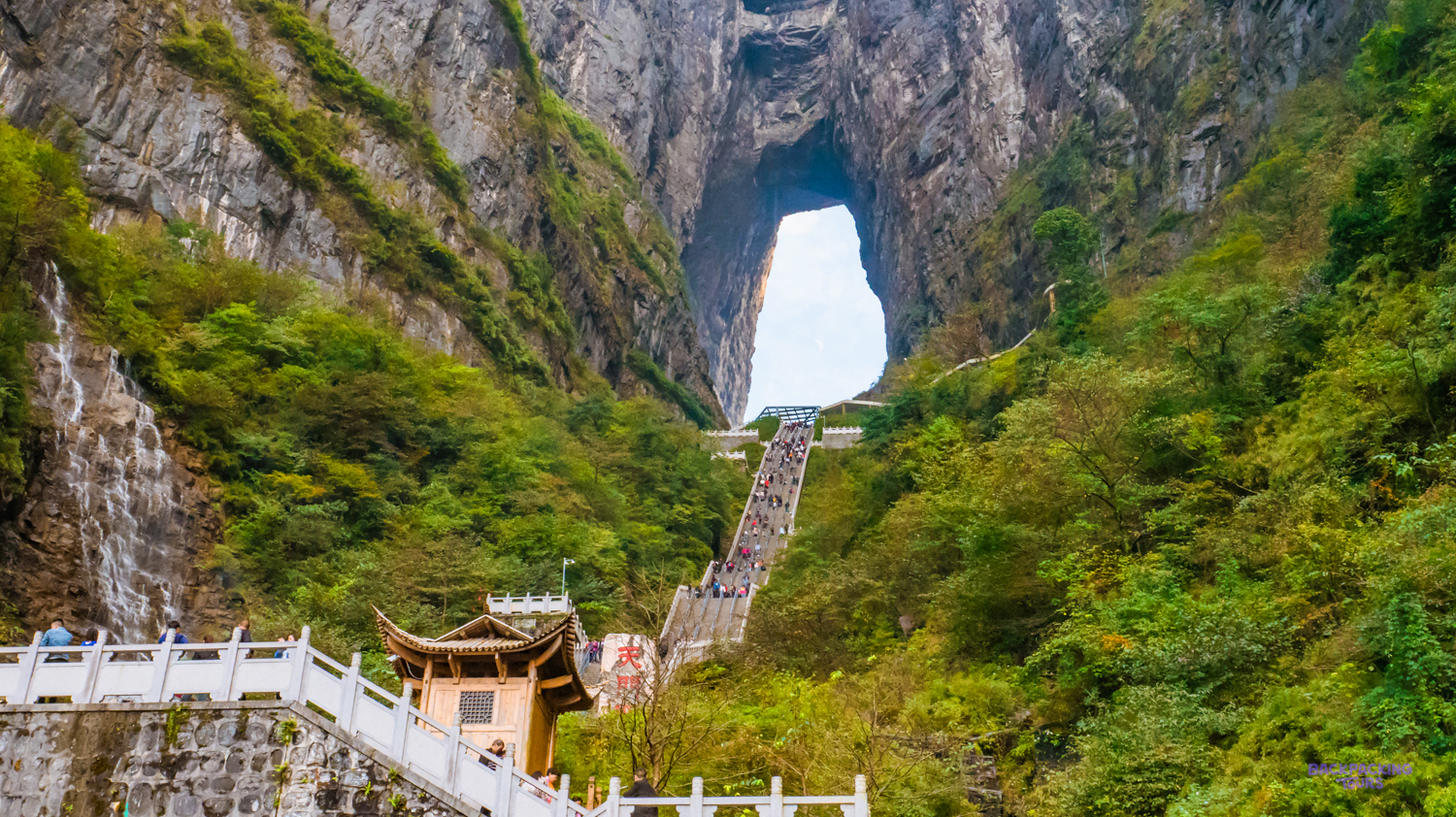 Visitors climb the 999 steps to Heaven's Gate, a spectacular natural arch in Zhangjiajie.