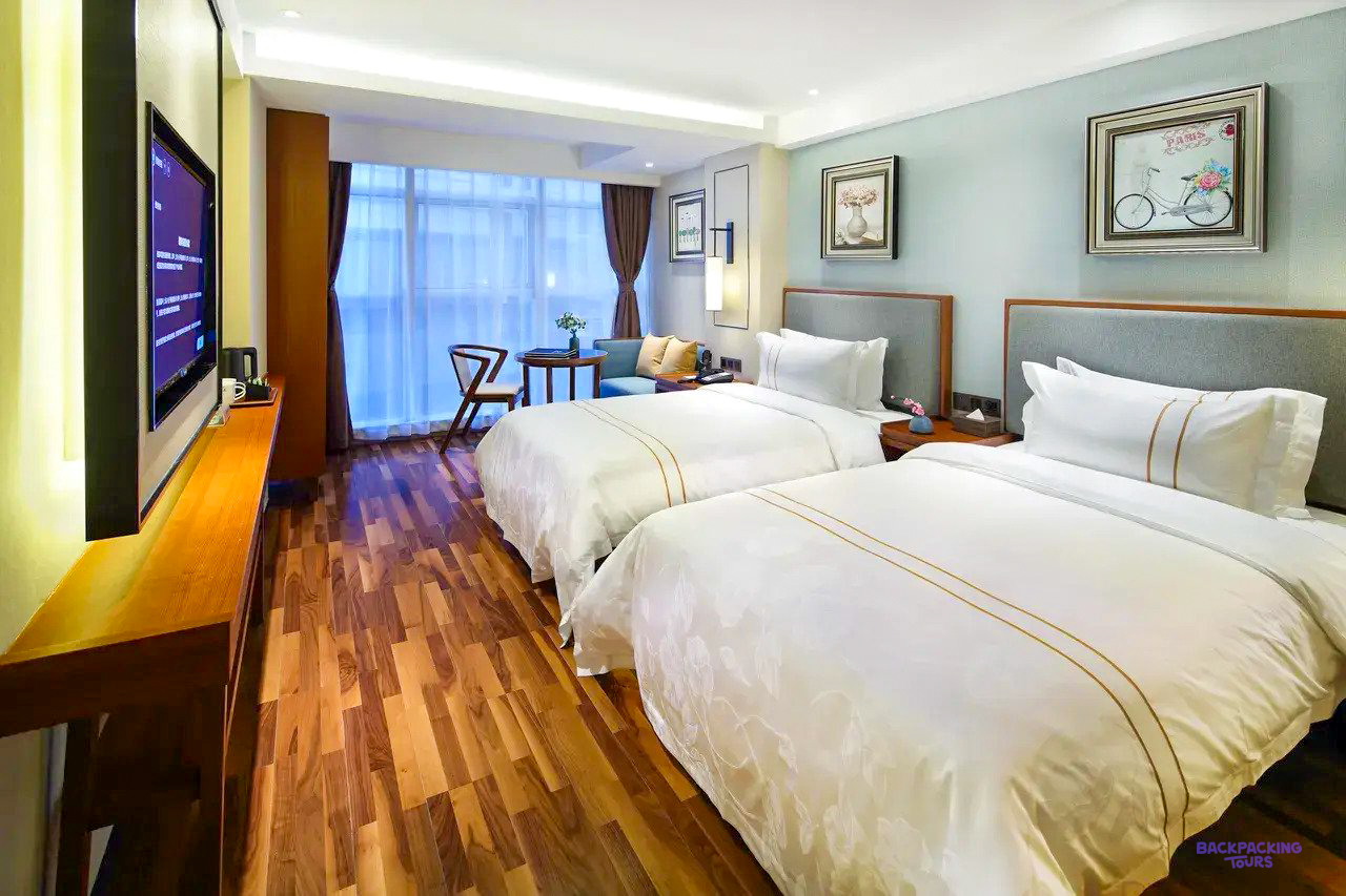 A twin room with wooden floors at the hotel in Shanghai