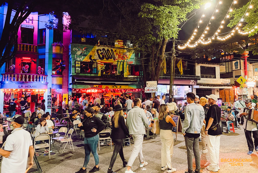 Medellín vibrant nightlife street scene with crowds