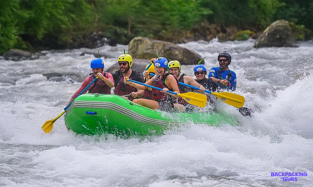 Six adventurers white-water rafting through rapids in a vibrant Costa Rican rainforest.