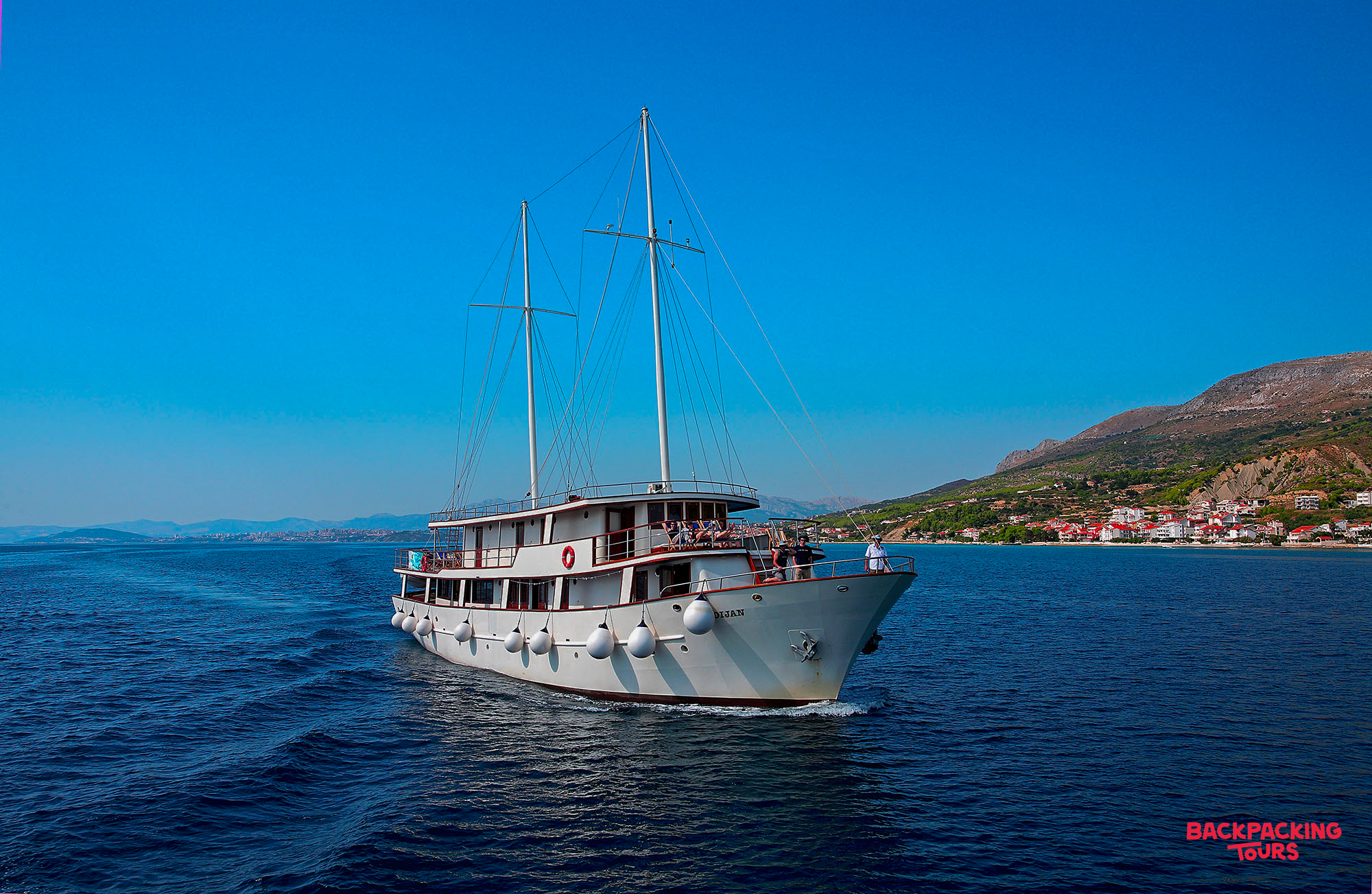 Guests enjoy the sun deck of our premium sailing boat cruising the beautiful Croatian coast.