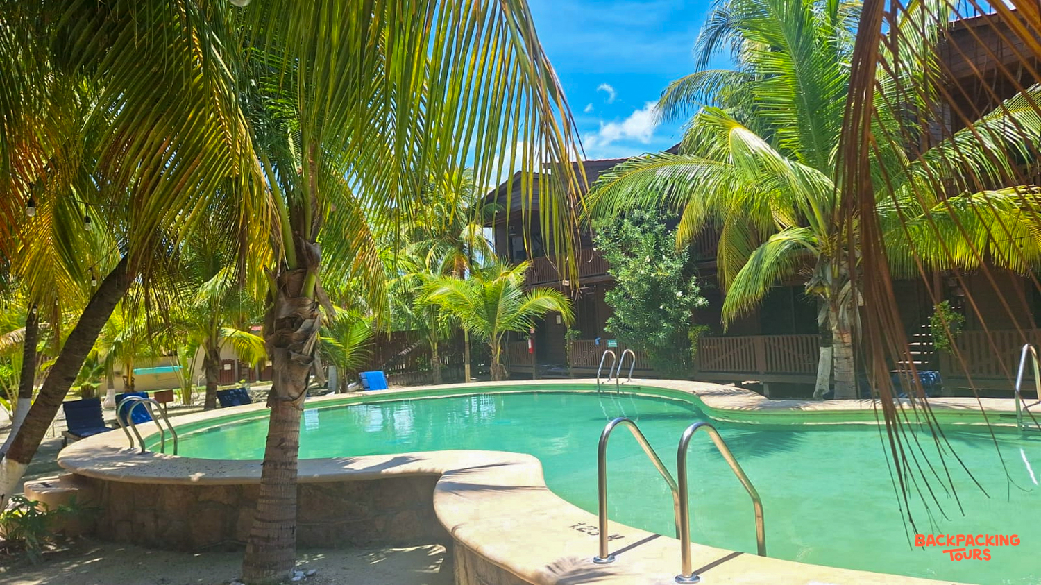 Enjoying the inviting turquoise pool and swaying palm trees at a tropical hotel on Isla Holbox.