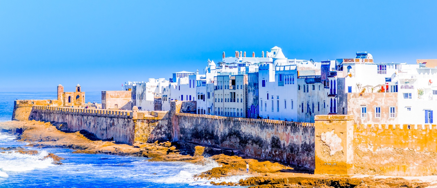 Essaouira's historic medina with white buildings and ancient fortifications overlooking the Atlantic Ocean.
