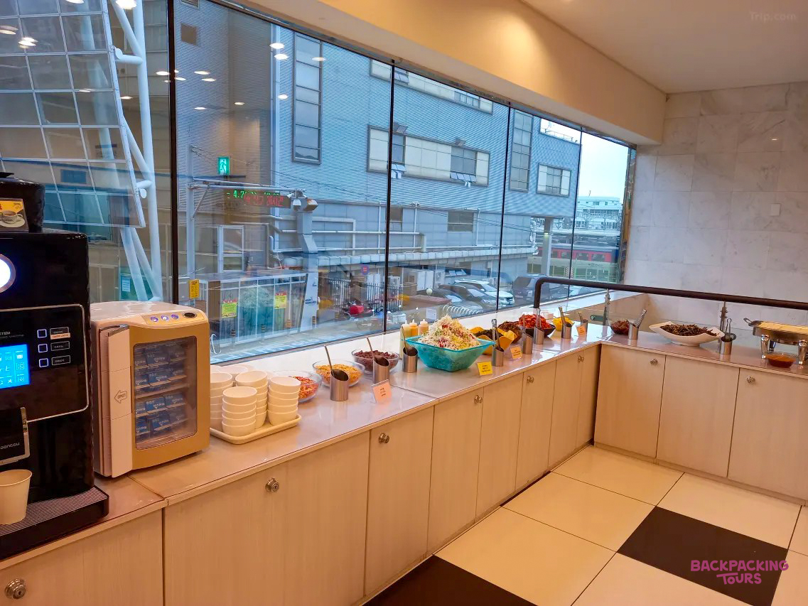 Hotel breakfast buffet in Busan, South Korea, offering a range of fresh food and drinks.
