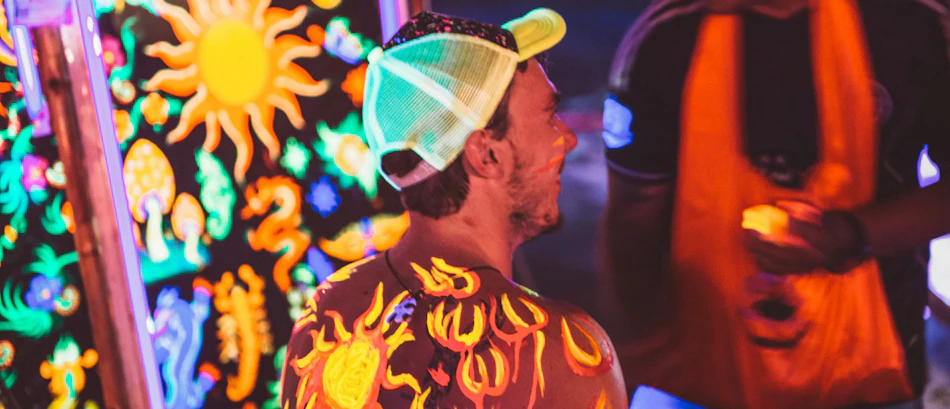A backpacker in glowing body paint at the Full Moon Party