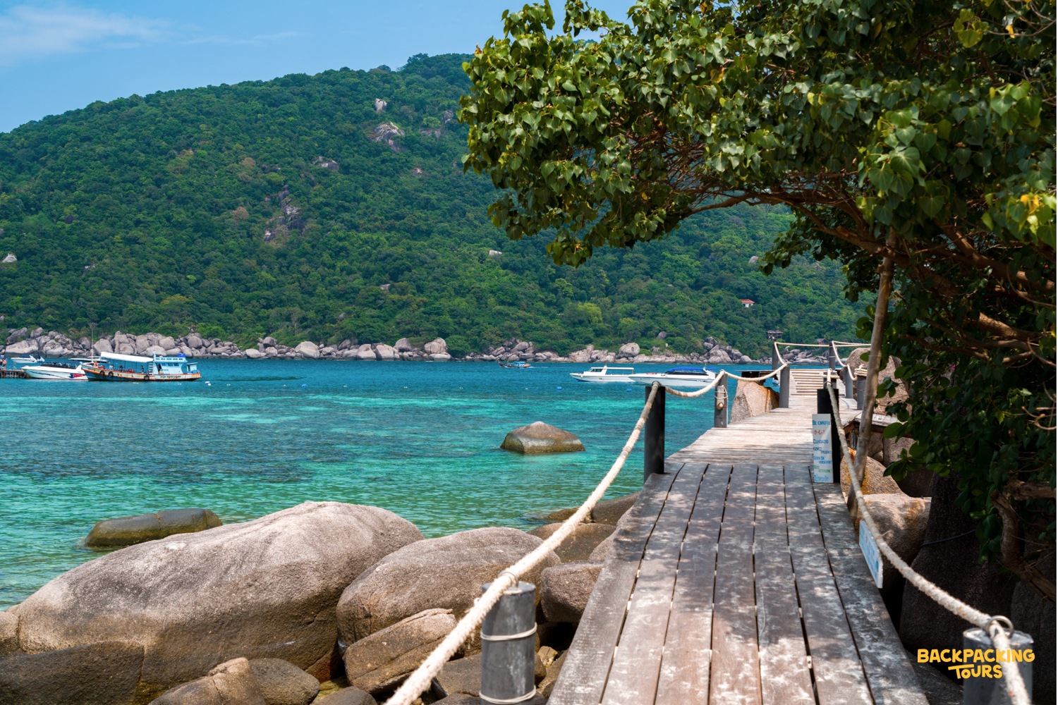 Walk along the scenic wooden boardwalk over crystal-clear waters at the beautiful Koh Nangyuan.