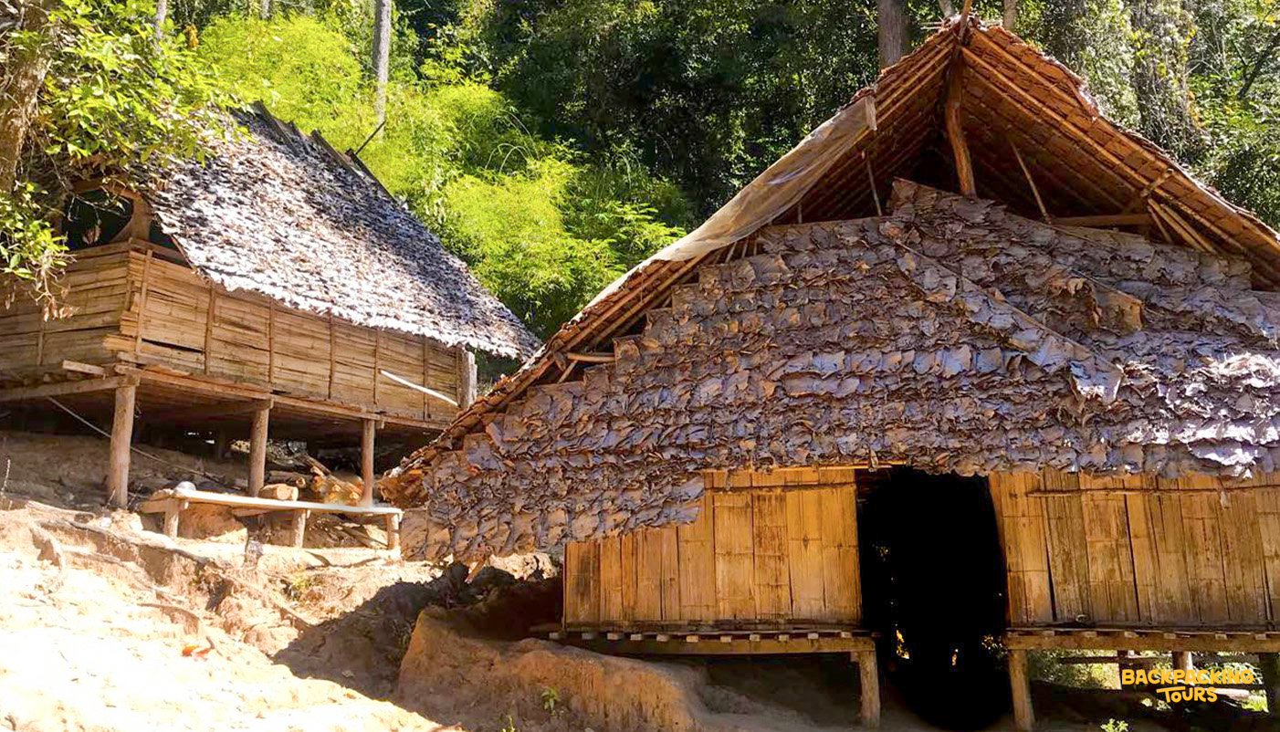 Traditional bamboo hut accommodation in hill tribe village for the backpacking group during the jungle trek