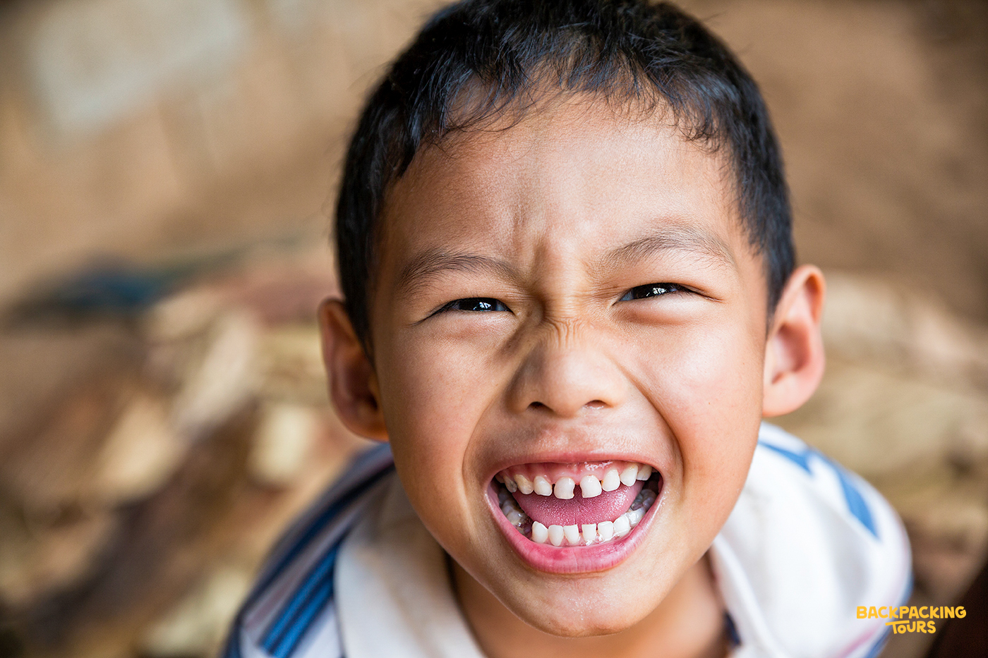 Smiling hill tribe child during the backpacking tour's jungle trek in the Chiang Mai hills