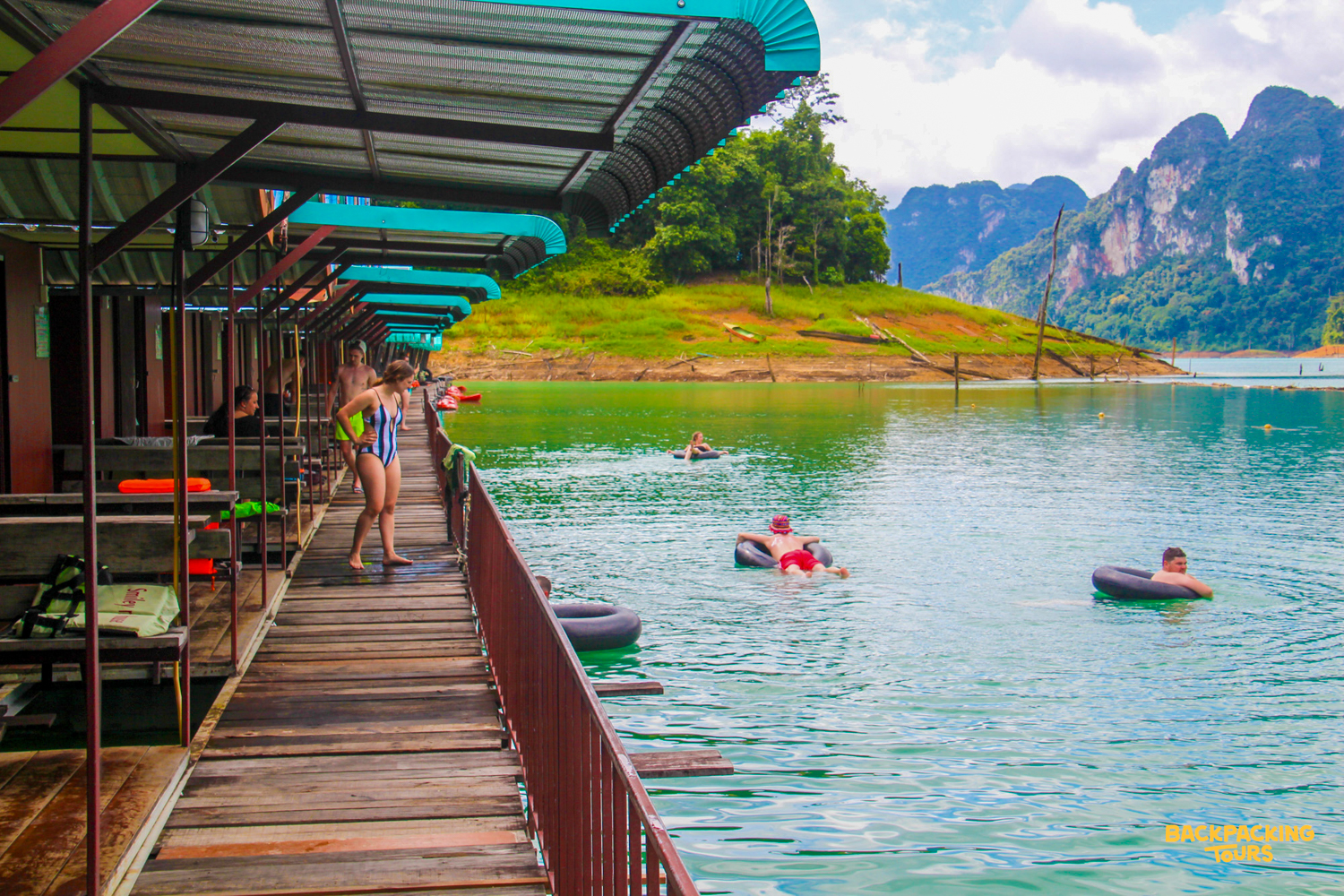 Guests relax in inner tubes by floating bungalows on Cheow Lan Lake, Khao Sok National Park.
